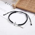 Handmade black woven rope bracelet featuring a stainless steel cross and adjustable cord - Black
