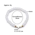 White glass bead stretch bracelet with gold accent beads and a cross charm pendant - White (BNS-0609-6 [Eco-friendly])