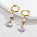 Ocean style drop earrings featuring a purple enamel crab pendant and gold finish - Purple Crab / Gold