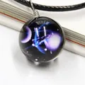 Macro detail of cosmic nebula glass pendant with artistic 3D galaxy patterns and wire wrap - Libra