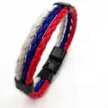 Detail of three-strand braided leather bracelet in white, blue, and red with black clasp - Russia Style