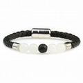 Close-up of braided leather cord bracelet with lava stone beads and silver magnetic clasp - White and Black