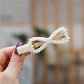 Elegant pearl bow hair clip with gold metal base for women's hairstyle decoration - Infinity