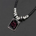 Collier constellation Scorpion avec corde tressée noire et perles argentées sur fond gris - Scorpion / Ciel Étoilé Scorpion