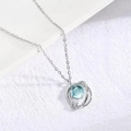 Silver star moon necklace featuring a blue round center stone and sparkling diamond accent - Blue Planet Style