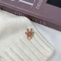 Cute Christmas reindeer brooch pin with brown enamel and gold accents on knit sweater - Reindeer Style
