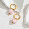 Detailed close-up of pink shell charms on golden titanium earrings with ocean-inspired theme - Light Pink