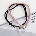 Matching astronaut couple bracelets with magnetic charm and adjustable woven ropes - Pink and Black