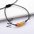 Minimalist hand-woven cord bracelet with three colorful cat eye stone beads - Black