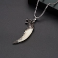 Detailed view of rock hip-hop stainless steel necklace with wolf head and tooth pendant - White Wolf Tooth