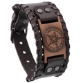 Detail of vintage brown leather punk bracelet featuring bronze pentagram and metal rivets - Star