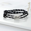 Black and white woven couple bracelets with magnetic silver sliders and adjustable knots - Black and White