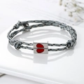 Matching magnetic woven couple bracelets in grey and white with a red enamel heart - Gray