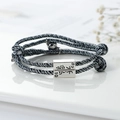 Matching magnetic couple bracelets with gray black woven ropes and engraved charms - Colorful