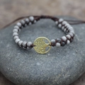 Handgefertigtes Lebensbaum-Armband mit grauen Marmorperlen und gewebter Kordel - Graugold