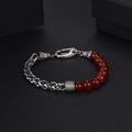 Detail of red agate beads and braided steel chain bracelet with a lobster clasp - Red Agate