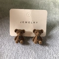 Brown flocked teddy bear stud earrings with black bow detail on a jewelry card - Brown (Ear Studs)