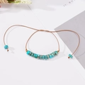 Adjustable hand-woven 6mm turquoise cylinder bead bracelet with gold metal accents - Turquoise Blue Texture