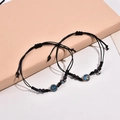 Braccialetti magnetici per coppie stella e luna con cordino intrecciato e ciondoli - Un Paio
