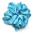 Oversized light blue satin scrunchie with a glossy silk texture and elegant pleats - Blue