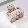 Elegant rectangular hollow hair claw clip in translucent amber brown acrylic finish - Transparent Gray