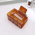 Minimalist hollow square hair claw clip in translucent amber resin for French twist hairstyles - Khaki