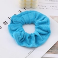 Bright blue terry cloth scrunchie with soft fluffy texture and elastic hair tie design - Blue