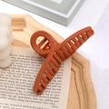 Pince à cheveux orange brûlé mate pour femme avec design croisé minimaliste - Orange Mat