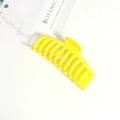 Close-up of 14cm matte yellow oversized shark hair claw clip with cross-tooth design - Yellow (14cm)