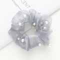 Detail of grey mesh organza scrunchie featuring elegant white pearl embellishments - Silver