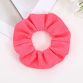 Detail of a bright rose pink scrunchie with soft mesh knitted texture and pleated design - Rose Pink