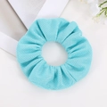 Detail of light blue scrunchie with textured mesh fabric and elastic hair band - Light Blue