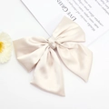 Elegant champagne satin bow hair clip with ribbons for women on white background - Off White