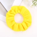 Detail of bright yellow mesh hair scrunchie with textured popcorn knit fabric - Bright Yellow