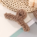 Primer plano de la textura de lana de cordero marrón en pinza de pelo para el otoño - Café Claro