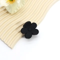 Detailed macro view of a large black matte flower-shaped hair claw clip on a white background - Simple Five-Petal Flower
