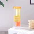Vue détaillée d'élastiques à cheveux jaunes gaufrés dans un pot de rangement clair - Jaune Et Orange