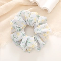 Detail of yellow floral scrunchie on waffle fabric with white wavy gypsum decor - Light Gray
