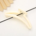 Minimalist cream matte shark hair claw clip with silver spring on beige paper fan - Off-white