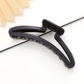 Minimalist large black matte hair claw clip for women on a clean white background - Black