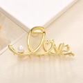 Elegante molletta per capelli in metallo dorato con scritta Love, cuore e perla - Oro
