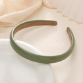 Dettaglio del cerchietto in pelle verde scuro con fodera antiscivolo in pelle scamosciata marrone - Verde
