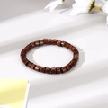 Detailed view of dark brown wooden cylinder beads bracelet with natural wood grain texture - Cylindrical Wooden Bead Style (4)