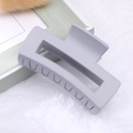 Large matte light grey square hair claw clip with rectangular hollow geometric design - Gray / Medium