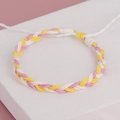 Detail of bohemian handmade woven bracelet with pink yellow white tassels and adjustable pull - Pink Yellow White Style (BN-0111-4)