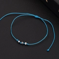 Dettaglio del bracciale in corda intrecciata blu fatto a mano con tre perline in metallo - Corda Blu Ematite Sfaccettata Bianco Nero (BNS-0207-Corda Blu Ematite Sfaccettata Bianco Nero)