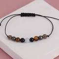 Macro view of handmade woven yoga bracelet with tiger eye and obsidian crystal beads - Black Flash Tiger Pattern with Black Cord (BNS-0209)
