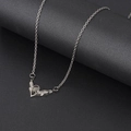 Elegant V-shaped silver necklace with heart projection stone and sparkling side crystals - Angel Wing (NST-0204)