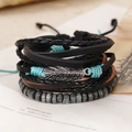 Close-up of vintage multi-layer woven leather bracelets with silver leaf charm detail - Metal Leaf Pendant Bohemian Style (BN-0129-8)