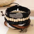 Detail of vintage multilayer leather bracelet with silver wing charms and wooden beads - Silver Wing Metal Ornament (BN-0129-20)